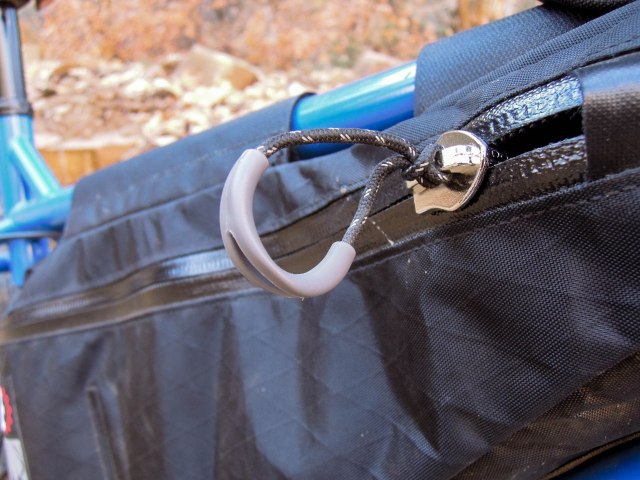Waterproof zippers with big loopy pulls.