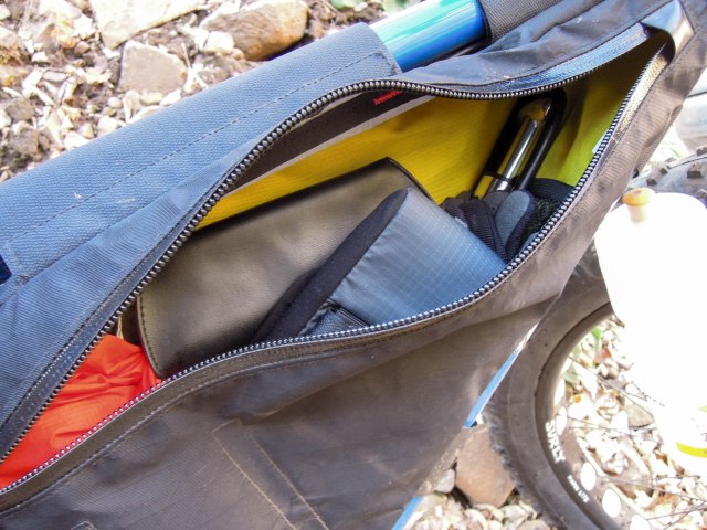 The main compartment, on the right side with all the gear mentioned except the camera and tripod. Still room for more gear.