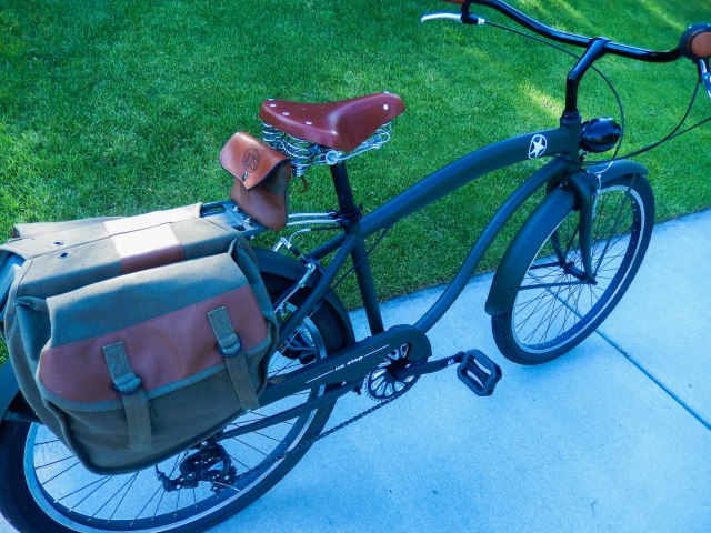 Canvas and leather saddlebags modified to fit the rack. And a custom seat bag.